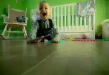 Full Length of Boy Sitting on Floor