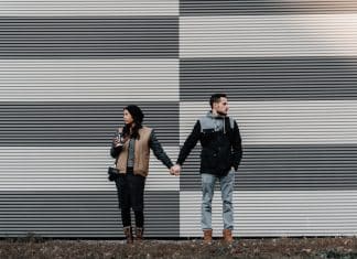 man and woman holding each other's hands
